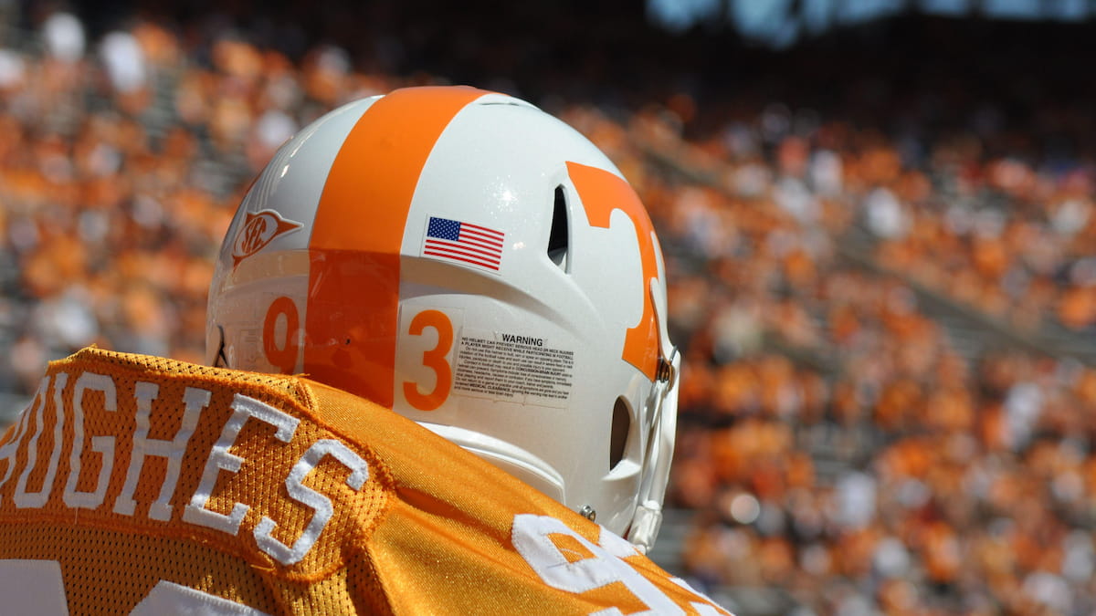 College football player from behind in front of huge crowds at Neyland Stadium in Knoxville, Tennessee.