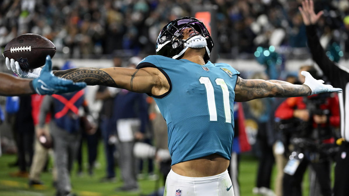 Jacksonville Jaguars player celebrates scoring a touchdown in an NFL regular season game.