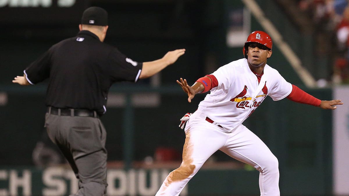 Umpire Todd Tichenor agreed that St. Louis Cardinals' Oscar Taveras had stolen second safely until the decision was overturned by replay.