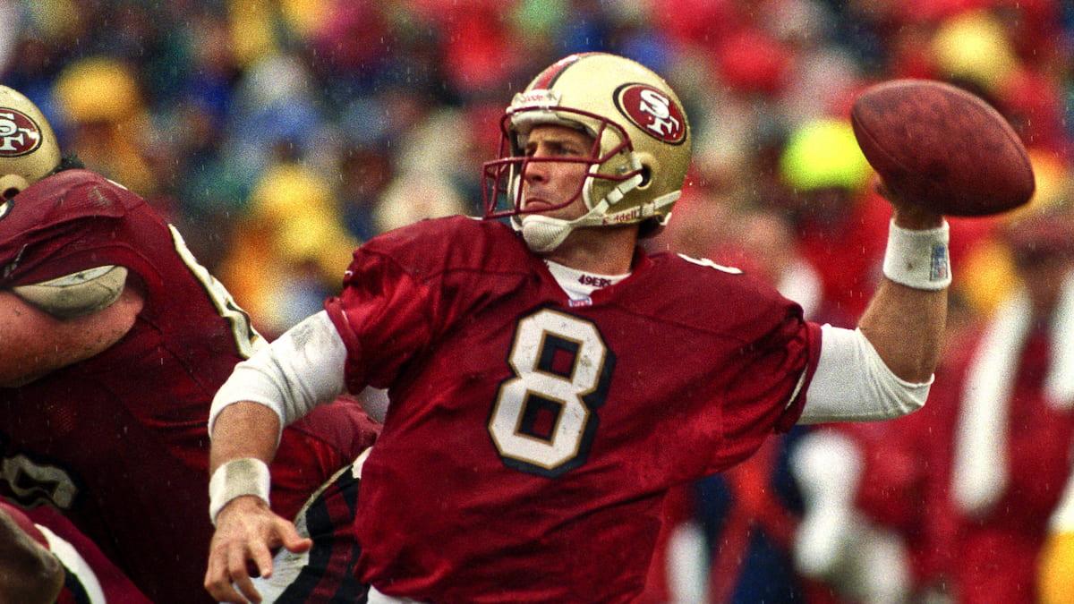 Steve Young playing quarterbacks for the San Francisco 49ers.