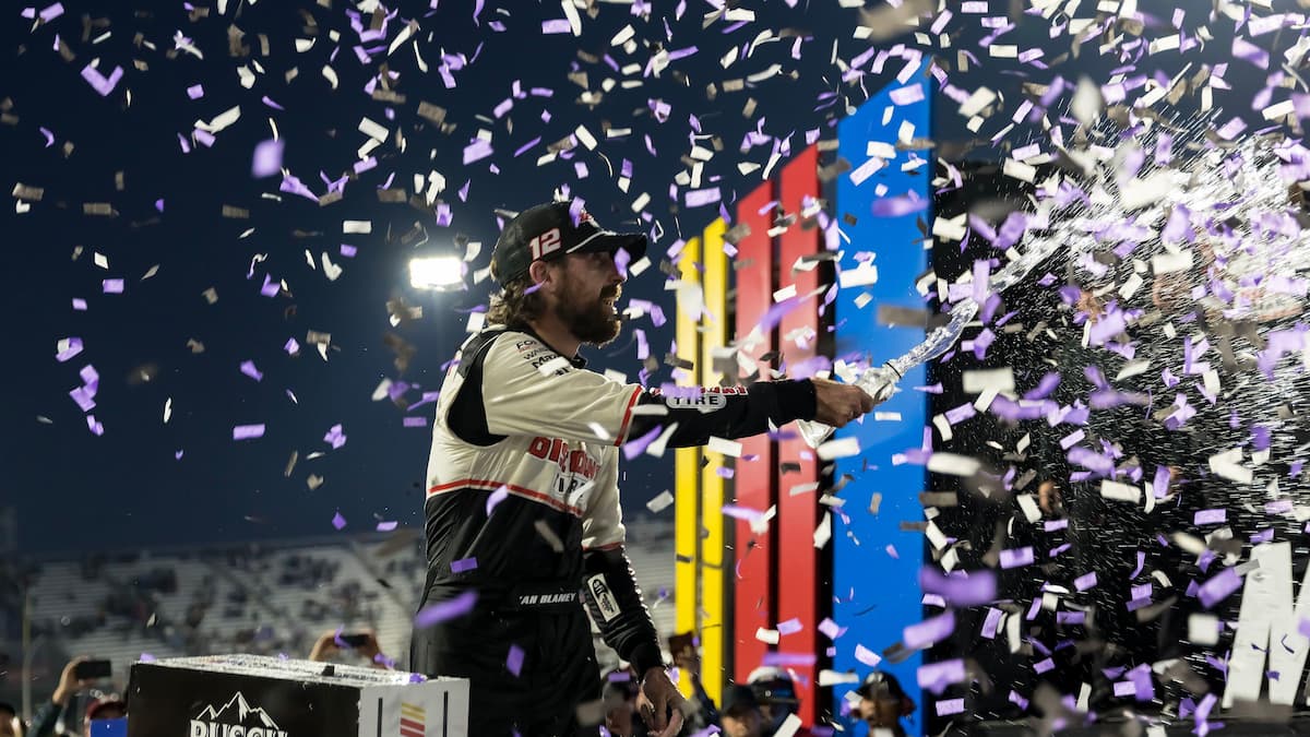 Ryan Blaney celebrates winning the NASCAR Cup.