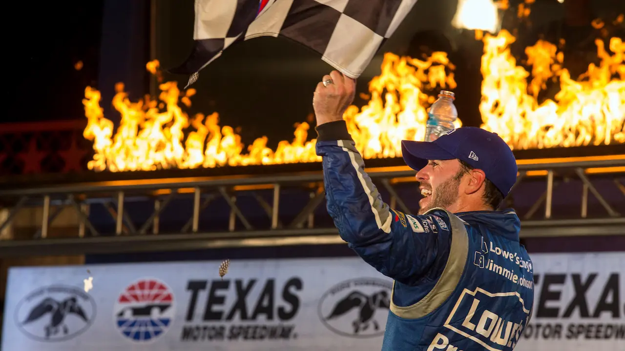 Jimmie Johnson celebrates a race win in the NASCAR championship.