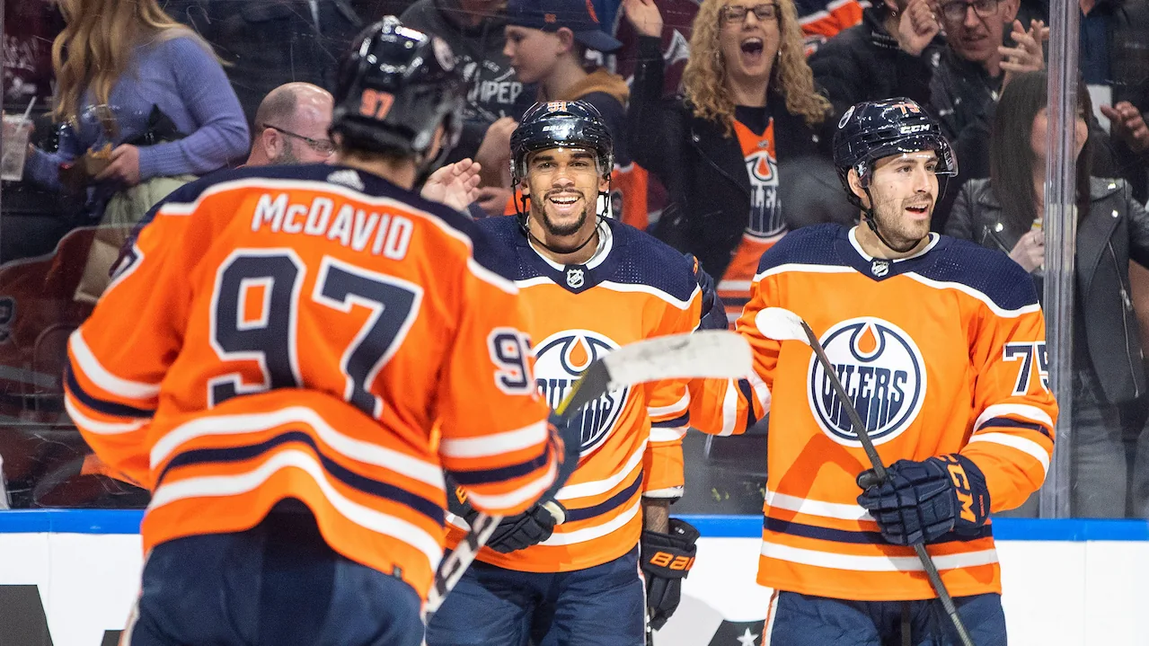 Center Connor McDavid celebrates a goal with his Edmonton Oilers teammates in the NHL.