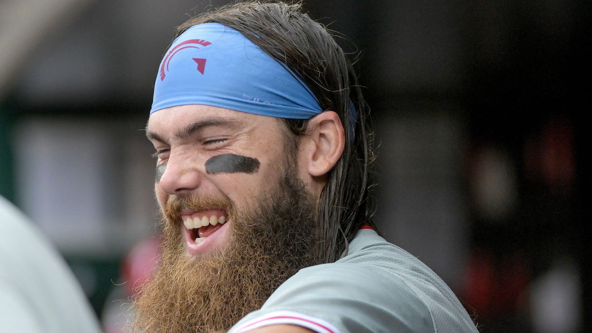 Baseball player laughing.