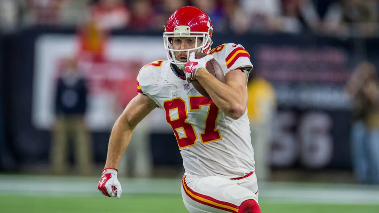 Travis Kelce running after a catch for the Kansas City Chiefs.