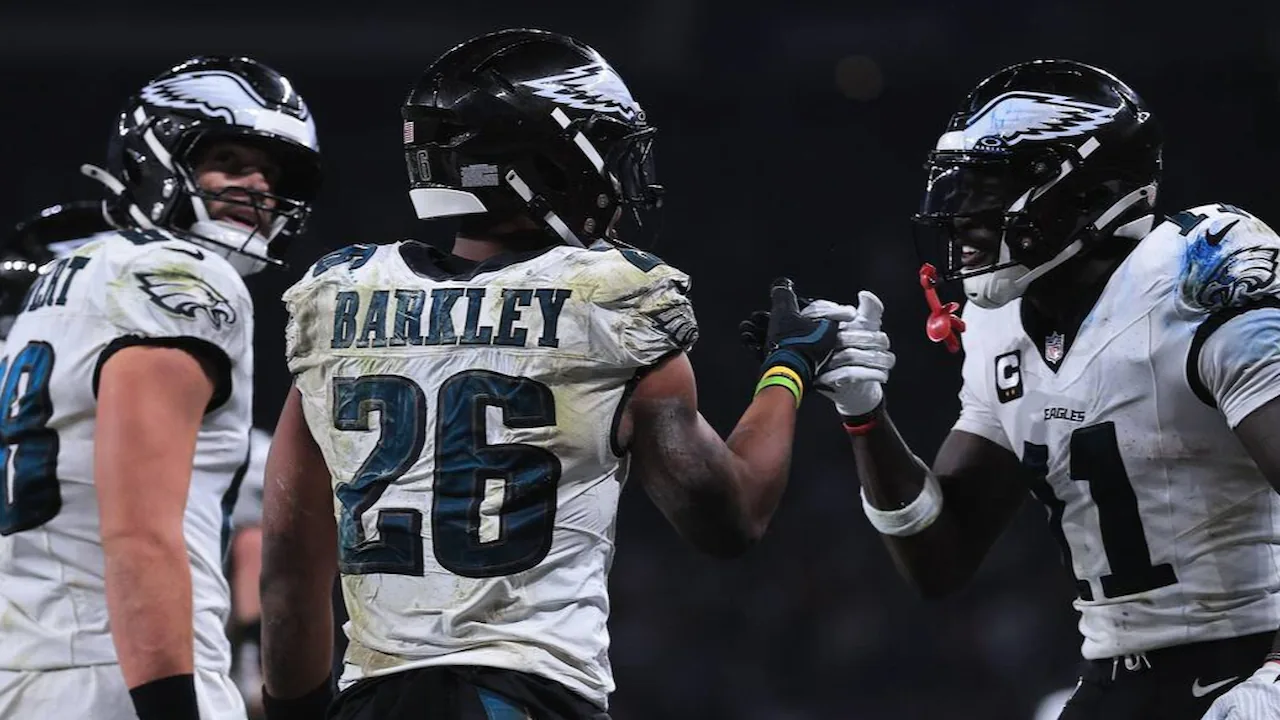 Saquon Barkley celebrating a touchdown with AJ Brown and Dallas Goedert