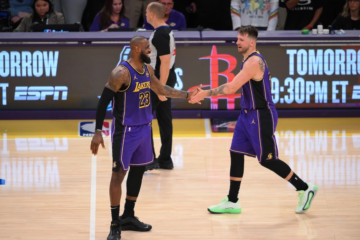 LeBron James and Luka Doncic playing for the LA Lakers.